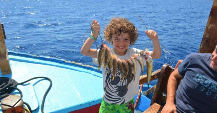 Rhodes Town: Fishing Boat Trip With Fish Meal and Swim Stops - Highlights of the Experience