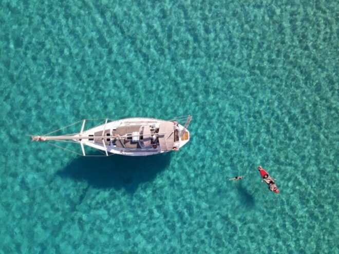 Rhodes Town: Private Sailing Cruise With Swim Stops & Meal - Activities: Swimming, Snorkeling, and Paddling
