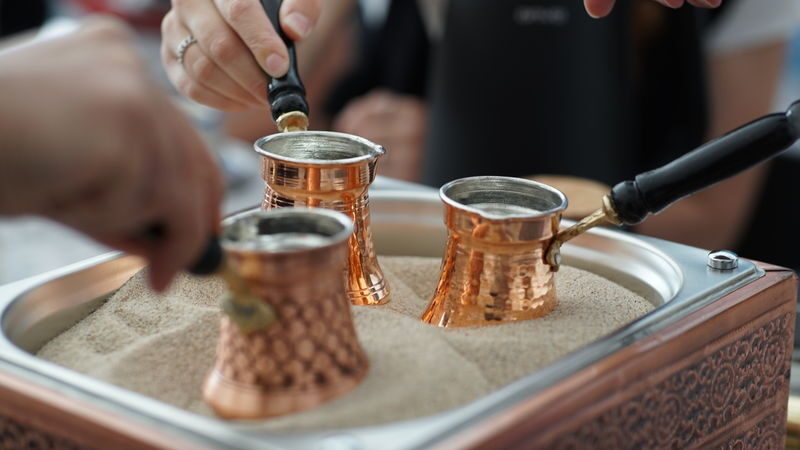 Rooftop Turkish Coffee & Fortune Telling Workshop with Fairy Chimney Views - Coffee on hot sand, with Göreme as the backdrop