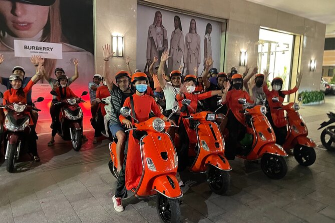 Saigon Vespa By Night Street Food With Female Riders Ao Dai - Indulging in Authentic Street Food Delicacies