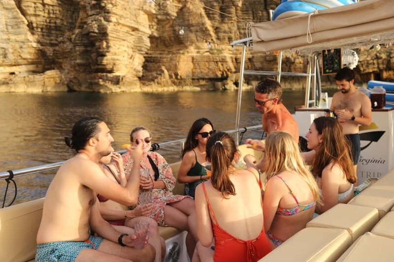 San Antonio: Cala Salada & Cala Gracio Sunset Boat Trip - Water Activities and Group Experience