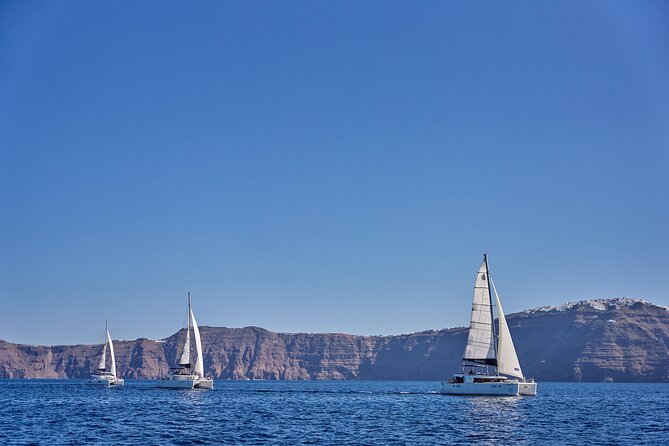 Santorini Oia: Luxury Day Catamaran Cruise With Bbq/Drinks - Pickup Details and Cancellation Policy
