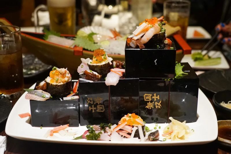 Sapporo Bar Hopping Food Tour - Start beneath the NIKKA sign in Susukino
