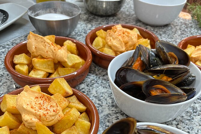 Seafood Paella Cooking Class, Tapas and Visit Market - Overview and Logistics