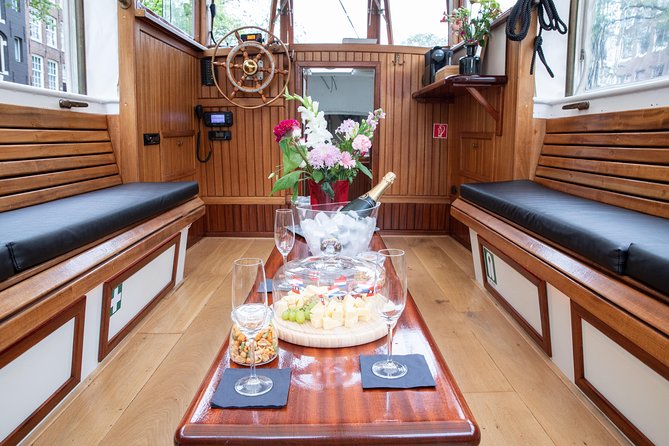Sebi Boat Tours - Amsterdam Small-Group Canal Cruise With Dutch Snacks and Drink - The Sum Up