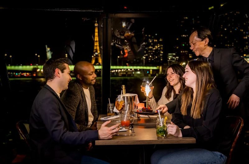 Seine River Dinner Cruise Experience in Paris - The atmosphere may be more festive than hushed