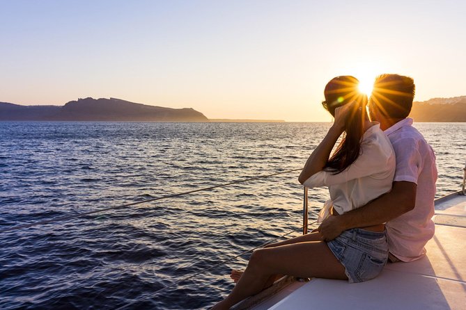 Shared Catamaran Romantic Sunset Cruise From Santorini via Volcano - Watching the Sunset Over the Aegean Sea