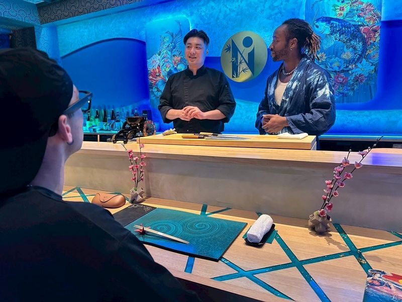 Shinsaibashi: SHIN NIPPON Artisan Sushi Making Course - A small counter, with sushi at the center