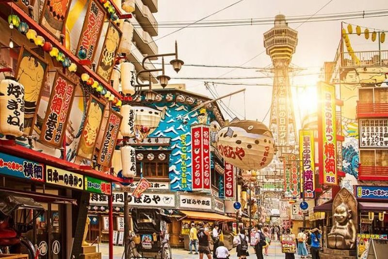 Shinsekai Night Food Tour with 15 Dishes & 3 Drinks - Shinsekai after dark, with dinner in the backstreets