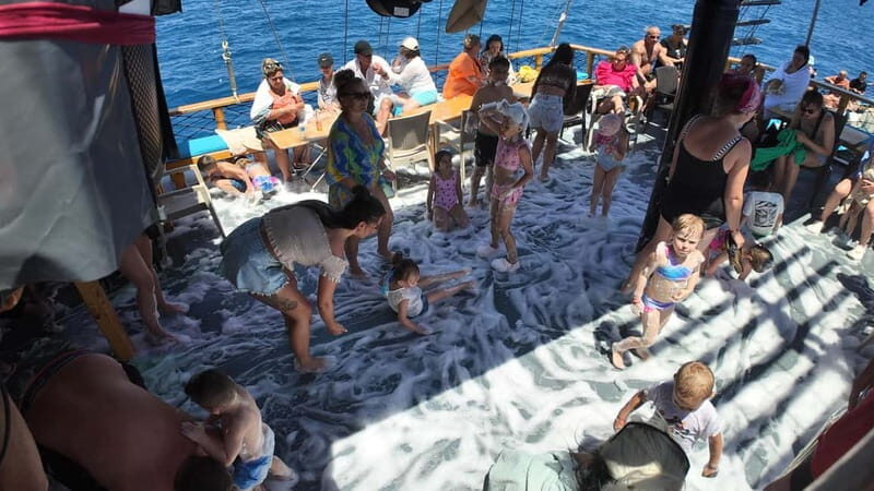 Side: Dolphin Boat Tour With Lunch Foam party Swimming - The Sum Up