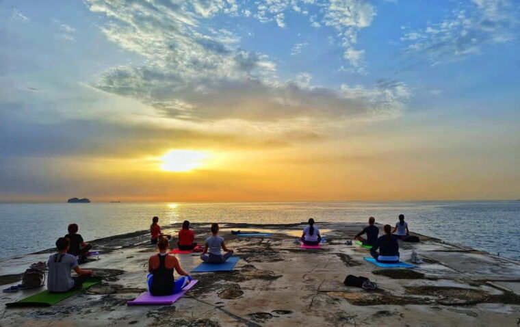 Sliema: Beach Yoga Class with Swimming - The Guides and Atmosphere  