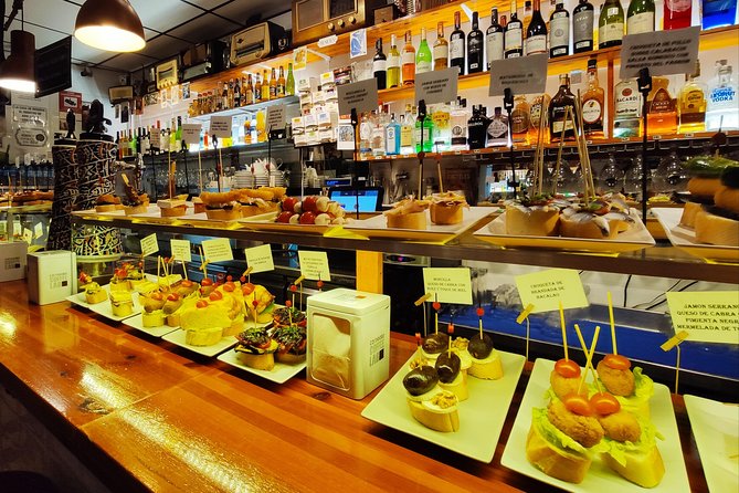 Spanish Wine & Tapas Tour in a Local Neighborhood in Barcelona - Tour Highlights