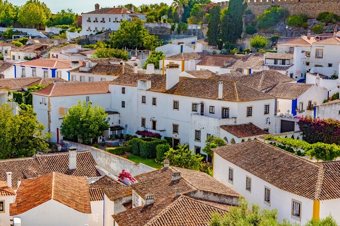Transfer From Lisbon to Porto W/ Óbidos, Fátima and Nazaré - Stops in Óbidos, Fátima, and Nazaré