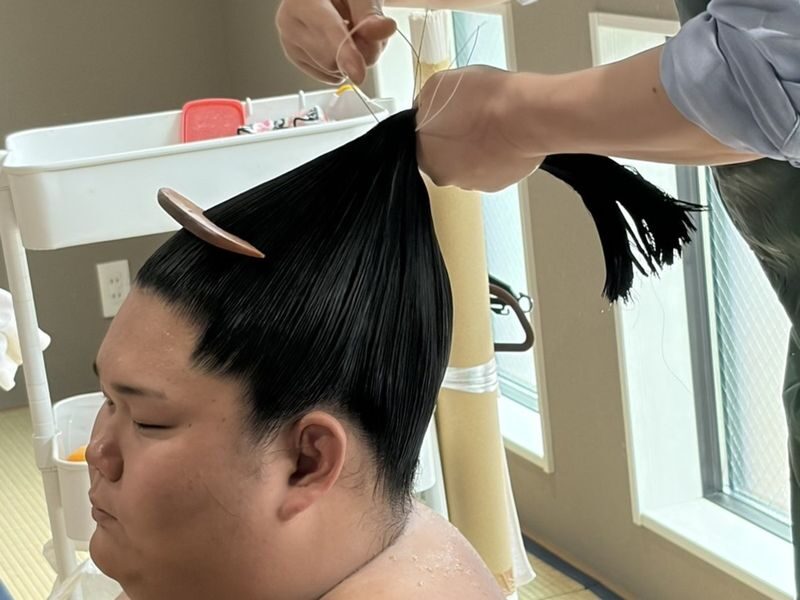 Watch Sumo Training in Tokyo: Experience sumo up close! - The optional topknot and meal package