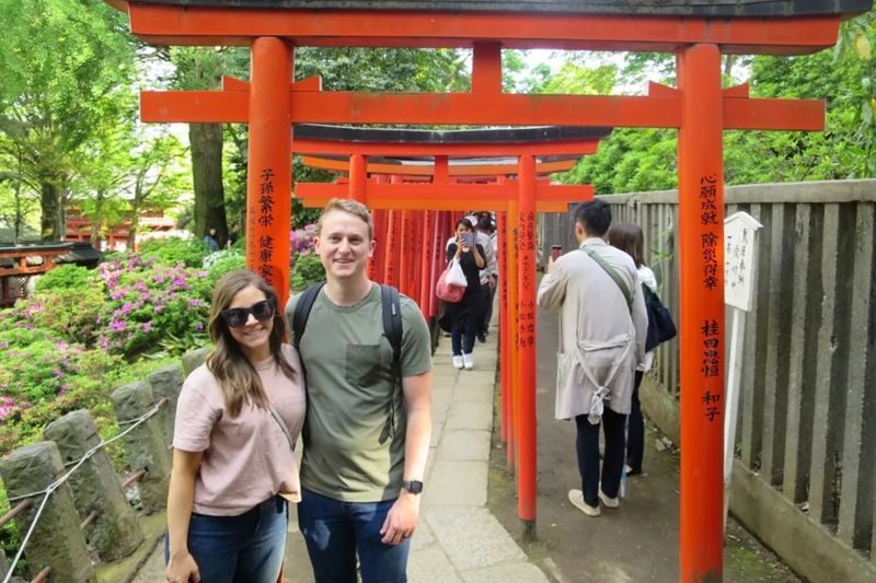 Yanaka Historical City Exploration Walking Tour in Tokyos Old Town - At Nezu Shrine, follow the red gates
